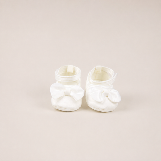 Elegant milk-colored baby shoes with strap